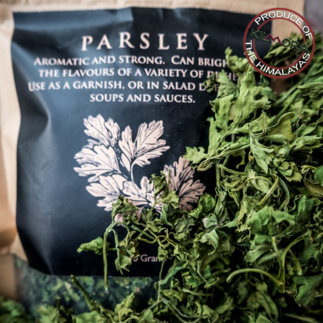 Kraft paper stand up pouch with black label giving information about Parsley
