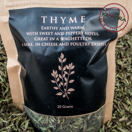 Kraft paper stand up pouch with black label giving information about the herb Thyme