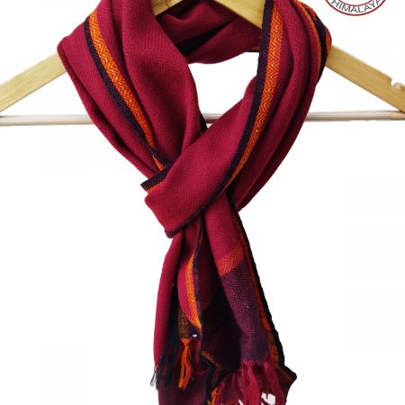 Hand-woven pure merino wool scarf in a shade of deep pink with a an edging and thin border of yellow and brown