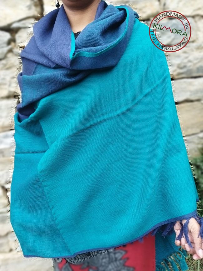 Handwoven women's woollen shawl from Kilmora in shades of blue ranging from azure to cobalt.