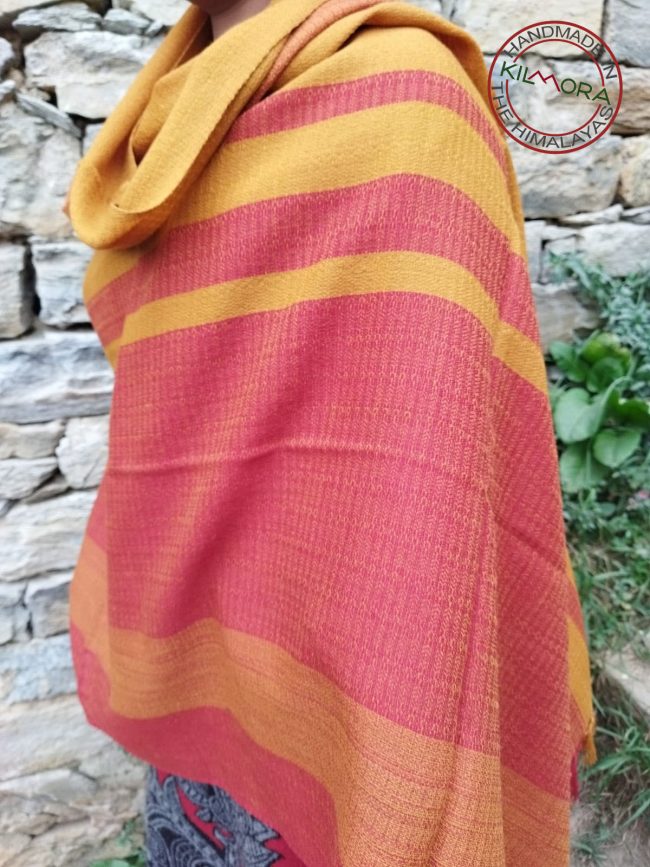Handwoven women's woollen shawl from Kilmora in bold horizontal stripes of crimson and ochre
