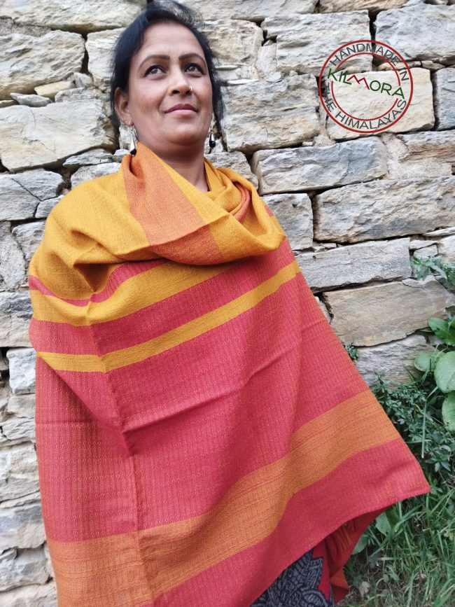 Handwoven women's woollen shawl from Kilmora in bold horizontal stripes of crimson and ochre