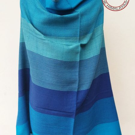 Handwoven women's woollen shawl from Kilmora in horizontal stripes of shades of winter skies. With blues ranging from azure to cobalt.