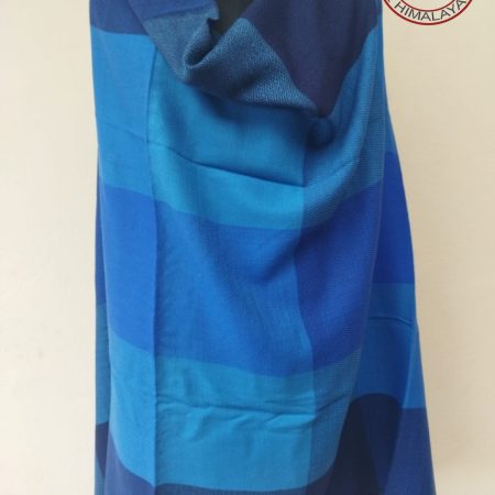 Handwoven women's woollen shawl from Kilmora in shades of blue ranging from indigo to turquoise and azure.