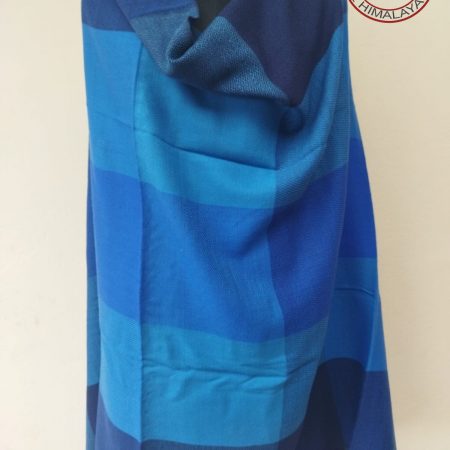 Handwoven women's woollen shawl from Kilmora in shades of blue ranging from indigo to turquoise and azure.