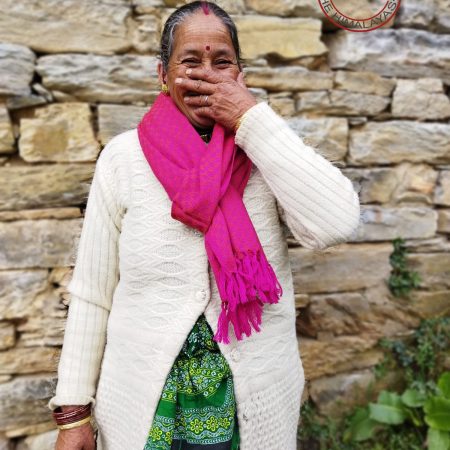 Woman wearing a pure merino wool hand-woven hot pink stole with textured self checks