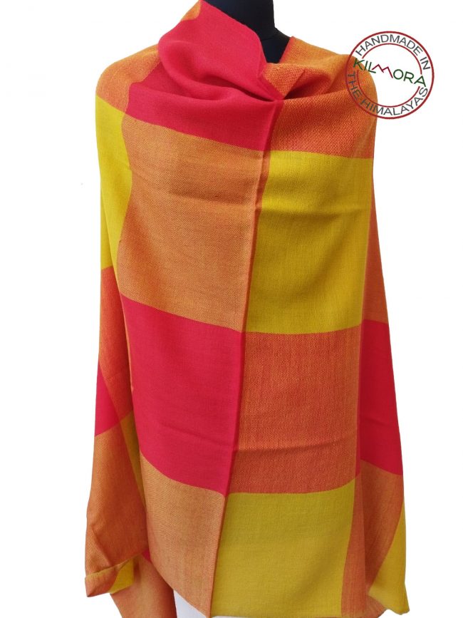 Handwoven women's woollen shawl from Kilmora in bold checks of oranges and yellows that look forward to spring.