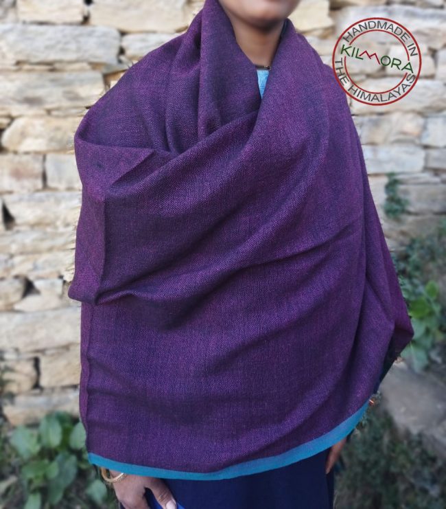 Handwoven women's woollen double shaded shawl from Kilmora in shades of plum and turquoise, with an edging of turquoise