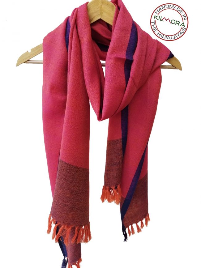 Pure merino wool hand-woven stole in watermelon pink with an edging of dark purple and a double shaded border of purple and pink.