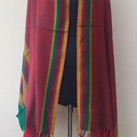 Welcome the festive season with Kilmora's handwoven shawl. In bold vertical stripes of deep green, maroon, yellows and reds.