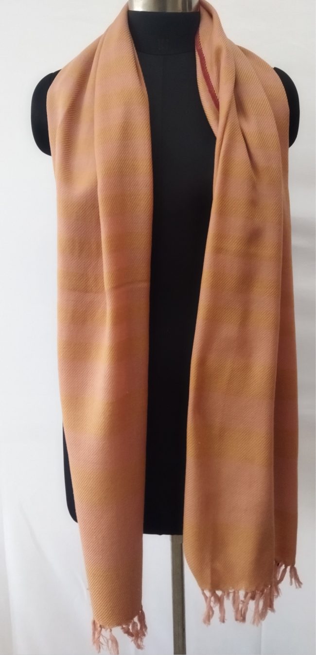 Pure merino wool hand-woven stole in vertical stripes of cream and gold.
