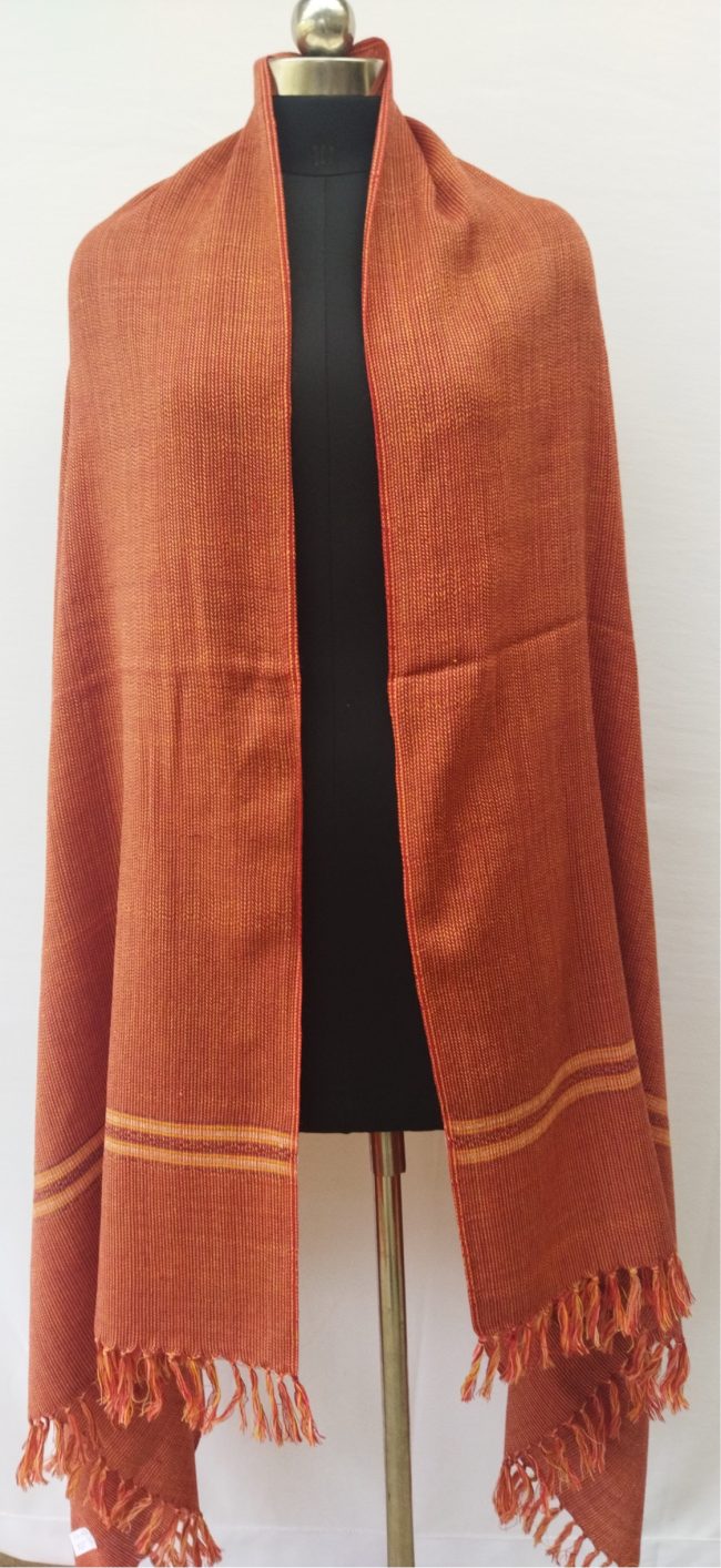 Handwoven shawl from Kilmora in tangerine with a beautiful weave pattern to elevate this shawl to one of effortless style and chic.