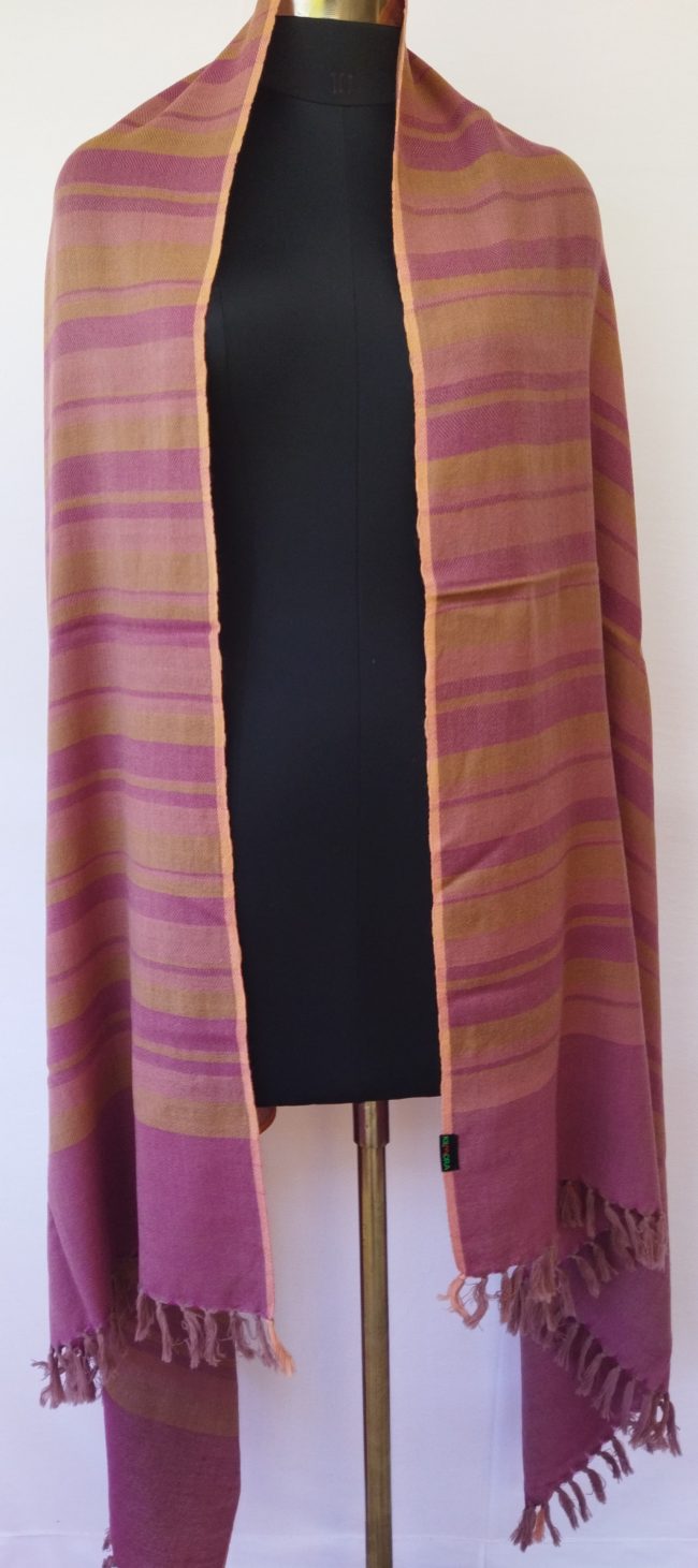 Handwoven pure merino wool shawl from Kilmora with varied vertical stripes in shades of deep rouge and ochre, edged with a thin border of salmon pink.