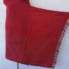 Handwoven pure merino wool shawl from Kilmora in ruby red with graduated thin horizontal stripes in black in the bottom half.