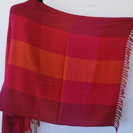 Handwoven pure merino wool shawl from Kilmora in bold checks of car m int, ruby red, burgundy, deep rouge.