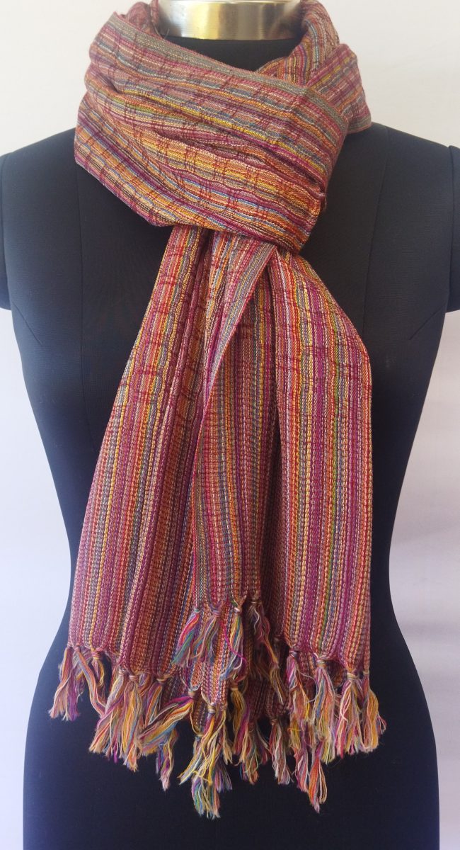 Pure merino wool hand-woven stole with a beautiful honeycomb like pattern and in thin stripes of purple, yellow, lavender, black, navy blue, royal blue, magenta, maroon.