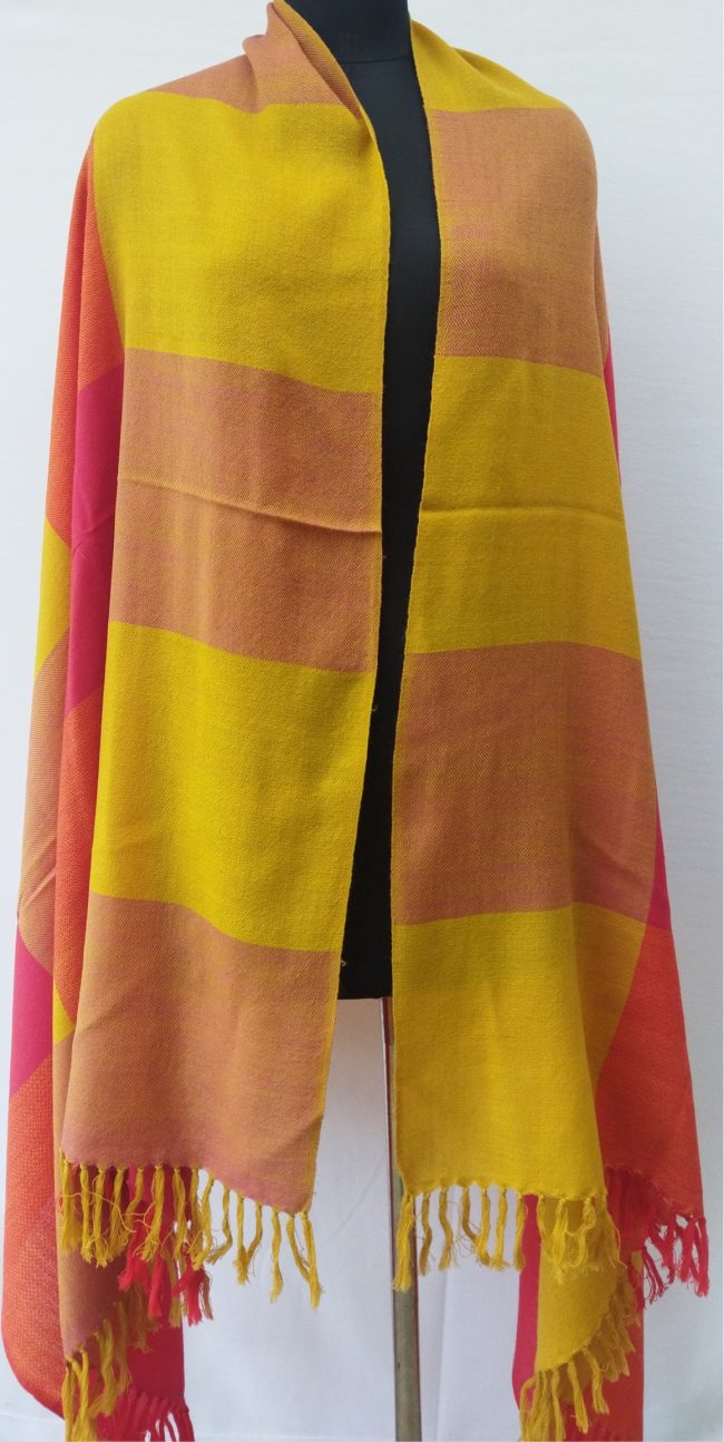 Handwoven pure merino wool shawl from Kilmora in vibrant bold checks of scarlet, orange, lemon yellow, and orange.