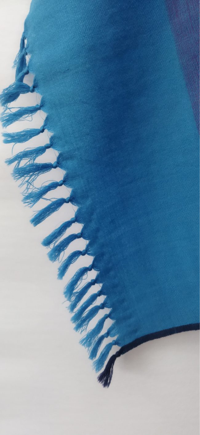 Pure merino wool hand-woven stole in a muted sapphire blue with a broad border of cerulean.