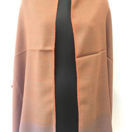 Self striped merino wool stole from Kilmora in cantaloupe orange with an undertone of azure.