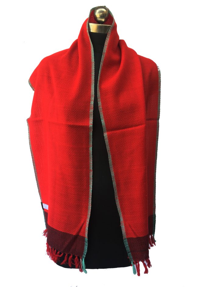 Pure merino wool scarf in bright candy red. Edged with turquoise blue and with a border of double shaded red and black.