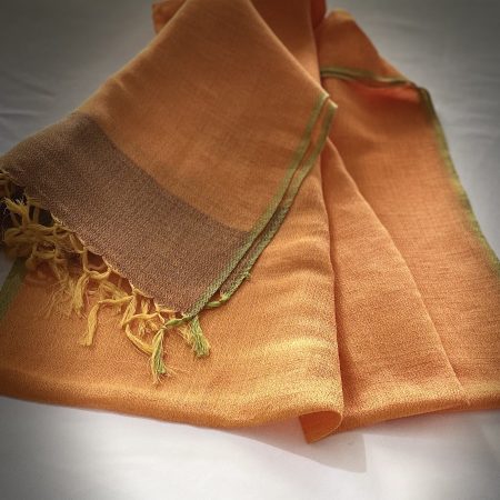 Cotton linen handwoven stole in a classic combination of royal orange with a border of burnt amber. And herringbone patterned olive green selvedge.