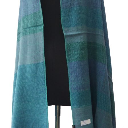 Pure woollen shawl from Kilmora. With bold vertical stripes in shades of azure, cobalt, cornflower, cerulean and pine.