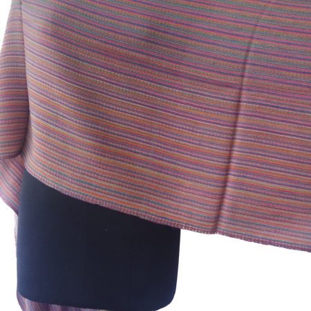 Merino wool stole with thin stripes shown on a mannequin. Stripes are in cantaloupe, red, purple, navy blue and white