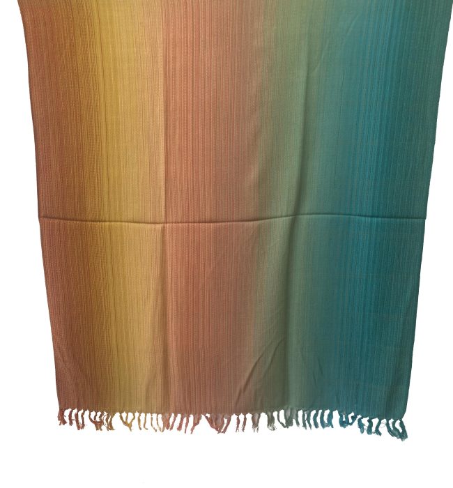 handwoven merino wool shawl in gradation in shades ranging from rust to yellow to peach to pine green