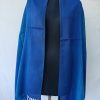 Ombre shades in this merino wool stole. Of arctic icy blue and blazing sapphire