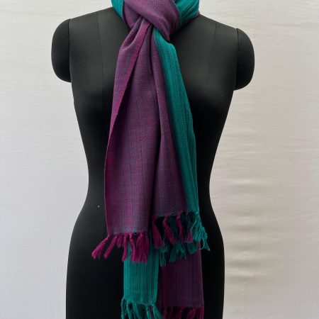 Merino wool stole knotted on a mannequin's neck. Stole is handwoven and with 2 broad vertical stripes in rich pine green and royal purple