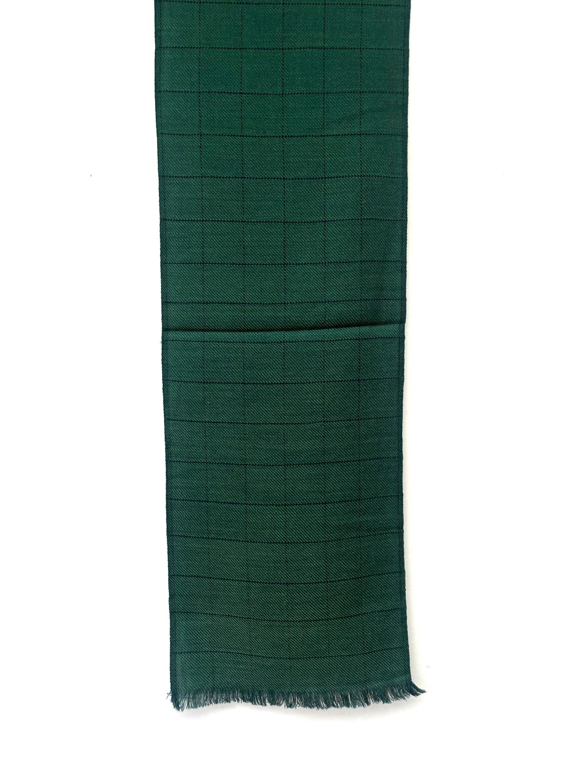 Handwoven merino wool scarf in deep pine green. Interwoven with navy blue checks.