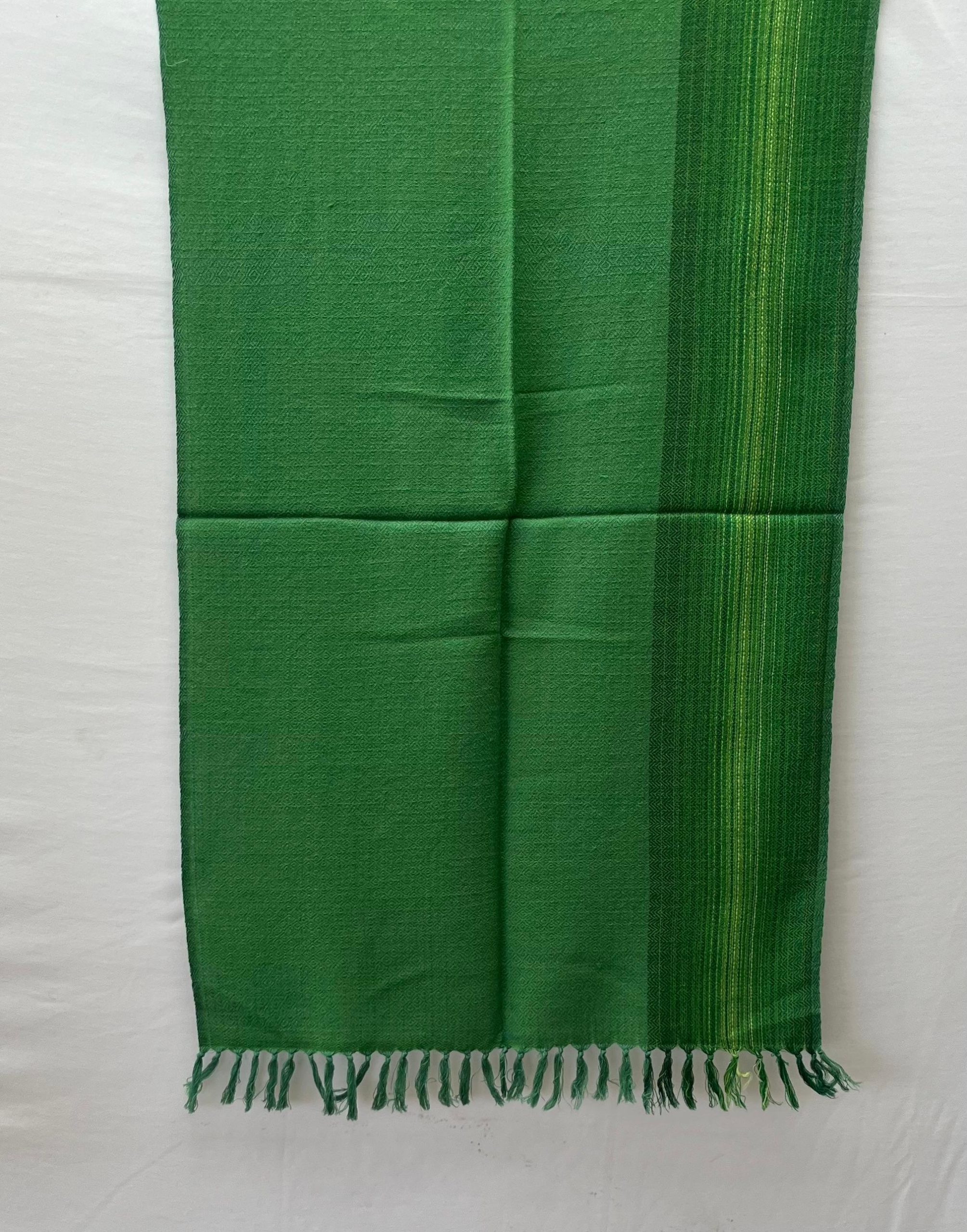 Handwoven in fern green with a vertical border on one side