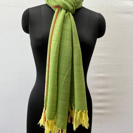 Handwoven merino wool stole in lime green with a thin red selvedge