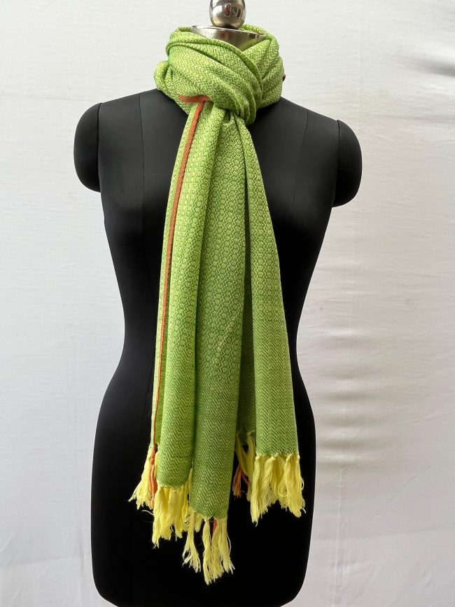 Handwoven merino wool stole in lime green with a thin red selvedge