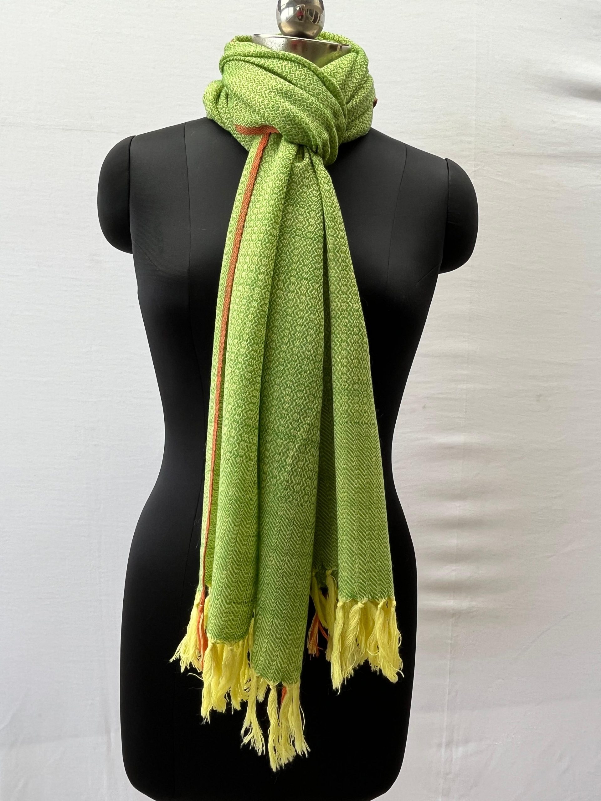Handwoven merino wool stole in lime green with a thin red selvedge