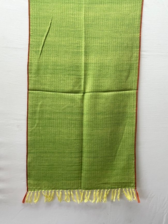 Handwoven merino wool stole in lime green with a thin red selvedge