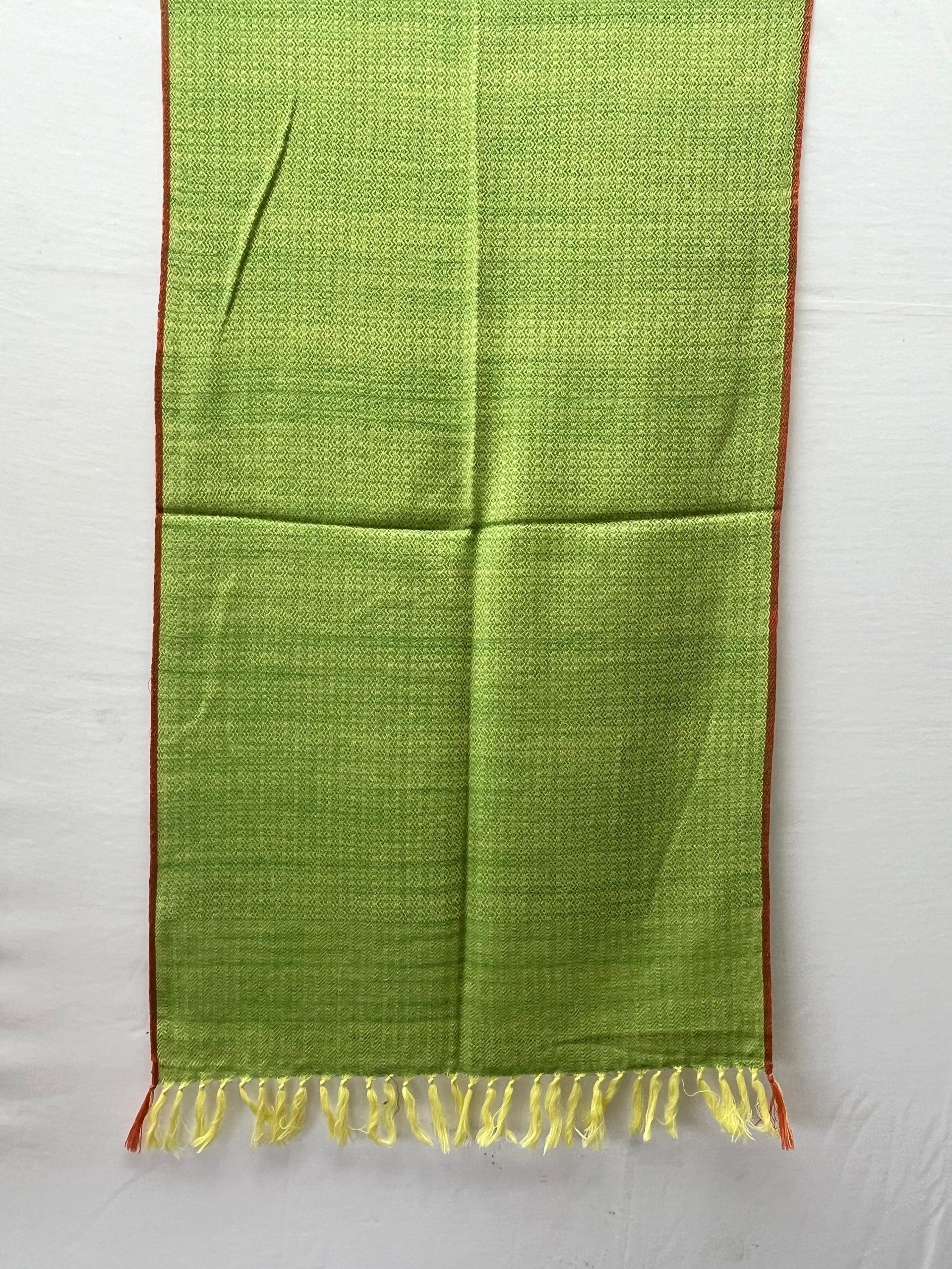 Handwoven merino wool stole in lime green with a thin red selvedge