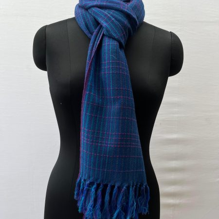 Azure blue merino wool stole with elements of cobalt blue, and pink woven in in stripes and checks.