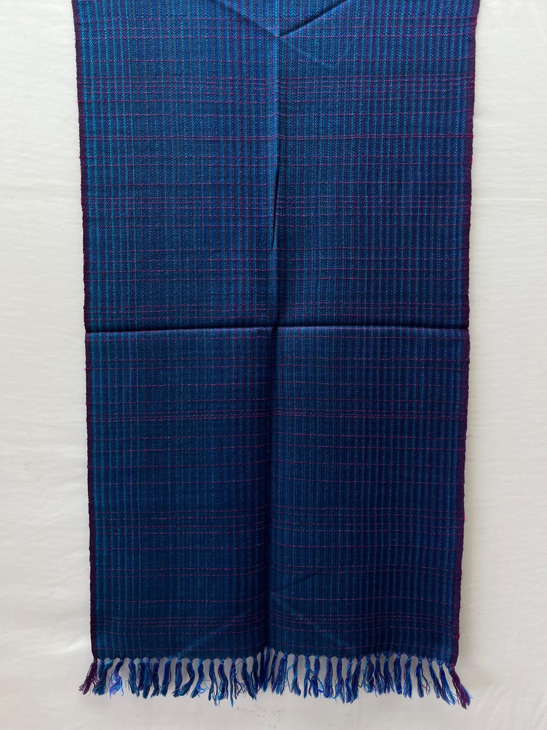 Azure blue merino wool stole with elements of cobalt blue, and pink woven in in stripes and checks.
