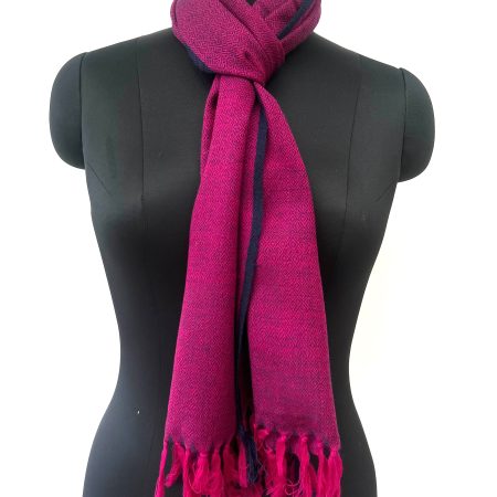 Handwoven merino wool scarf in purple with a diamond pattern and a thin navy blue selvedge