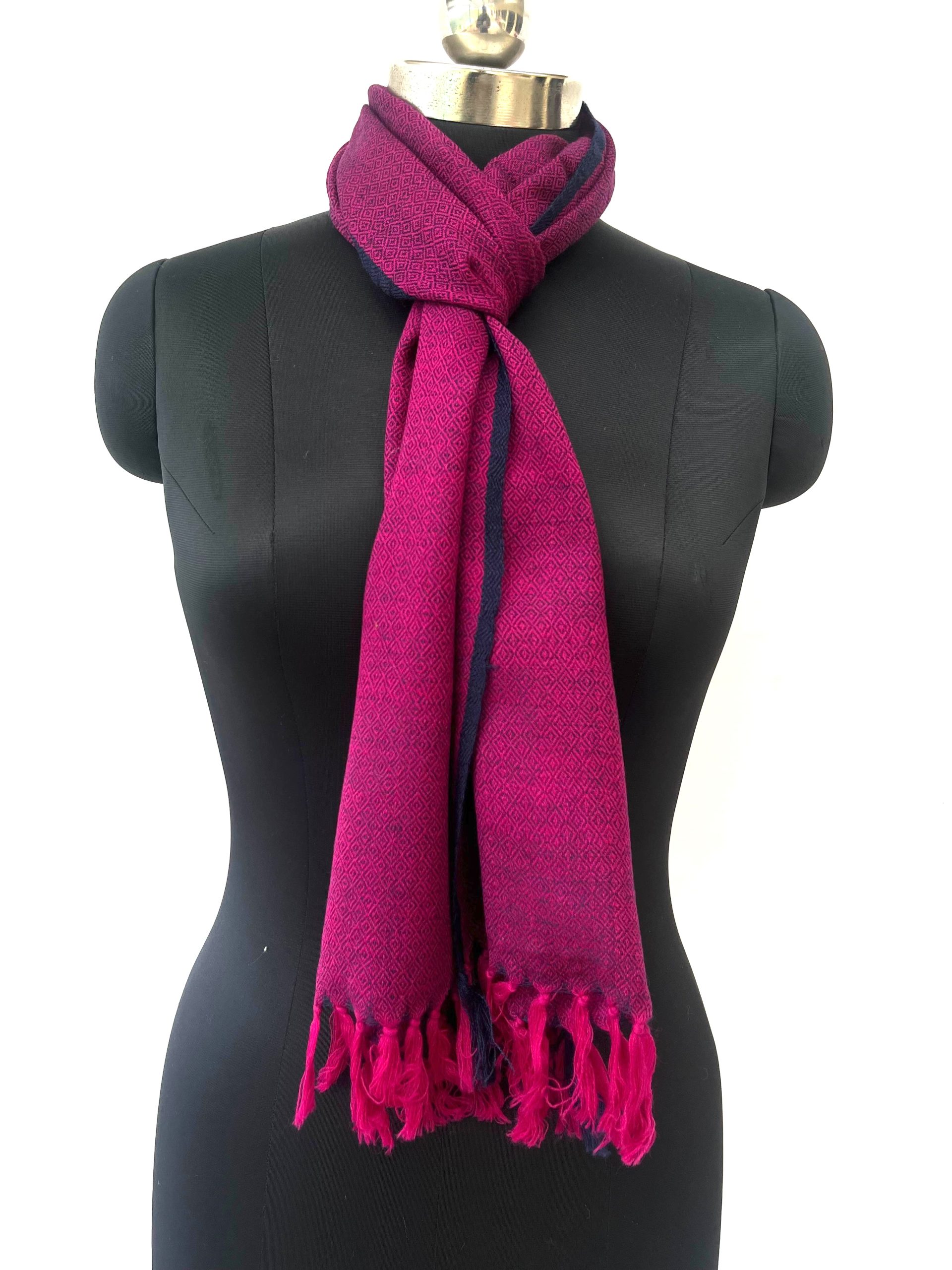 Handwoven merino wool scarf in purple with a diamond pattern and a thin navy blue selvedge