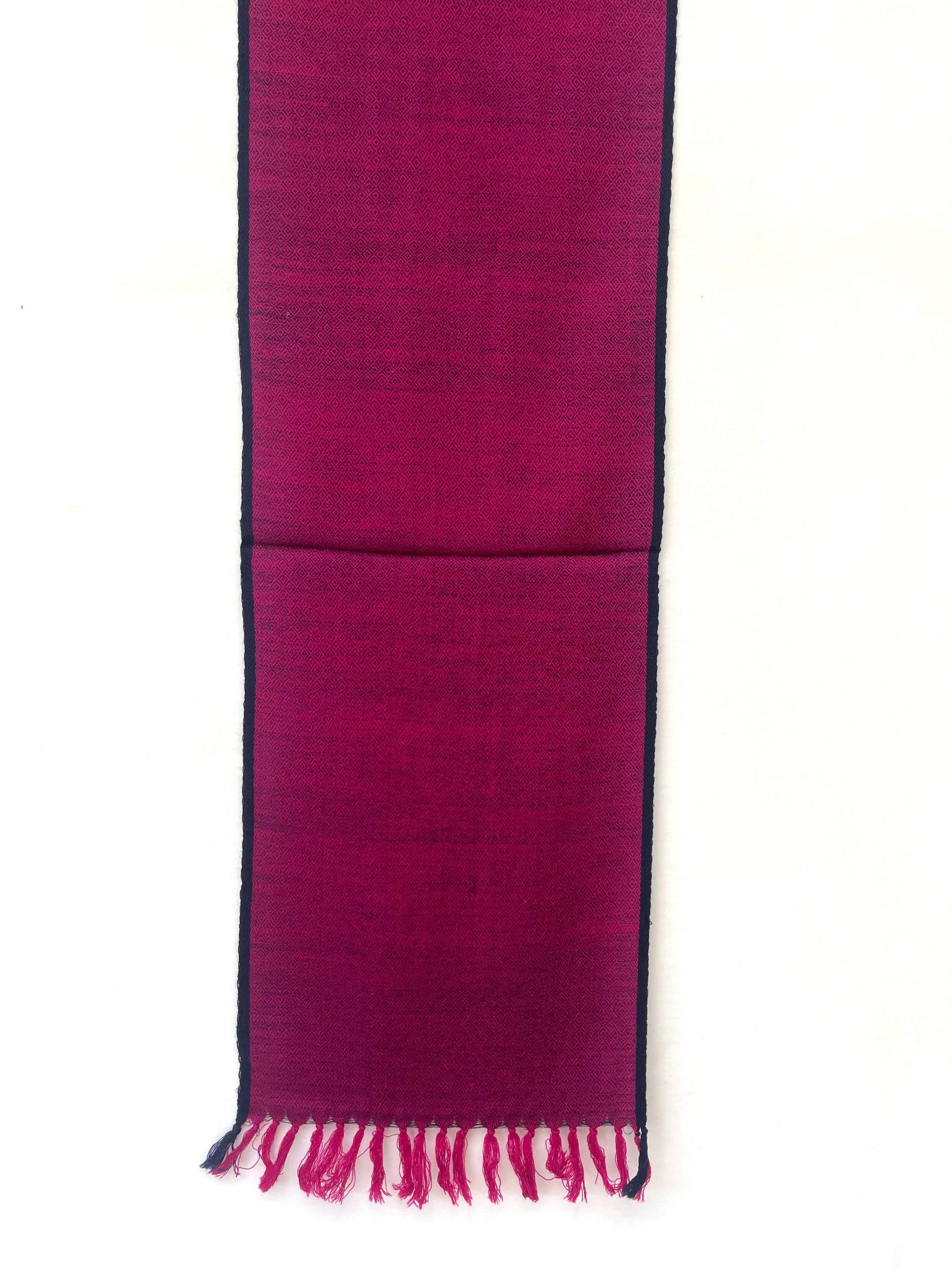 Handwoven merino wool scarf in purple with a diamond pattern and a thin navy blue selvedge