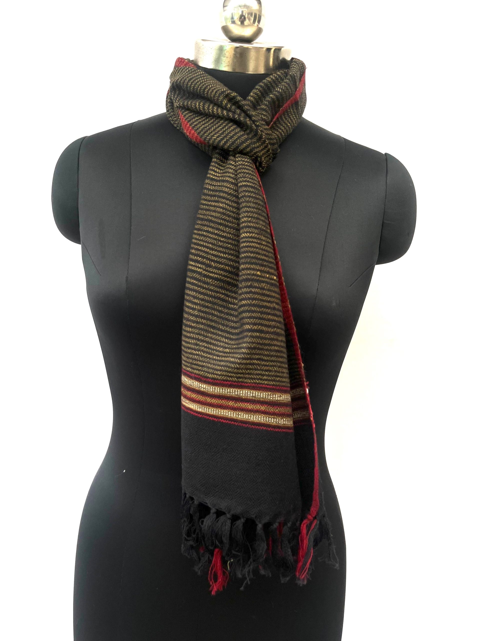 Handwoven merino wool scarf in black with a diamond pattern overlay in cream and a thin red selvedge