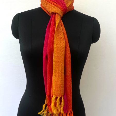 Merino wool scarf woven in vertical ombre shades of yellow, deep orange and red