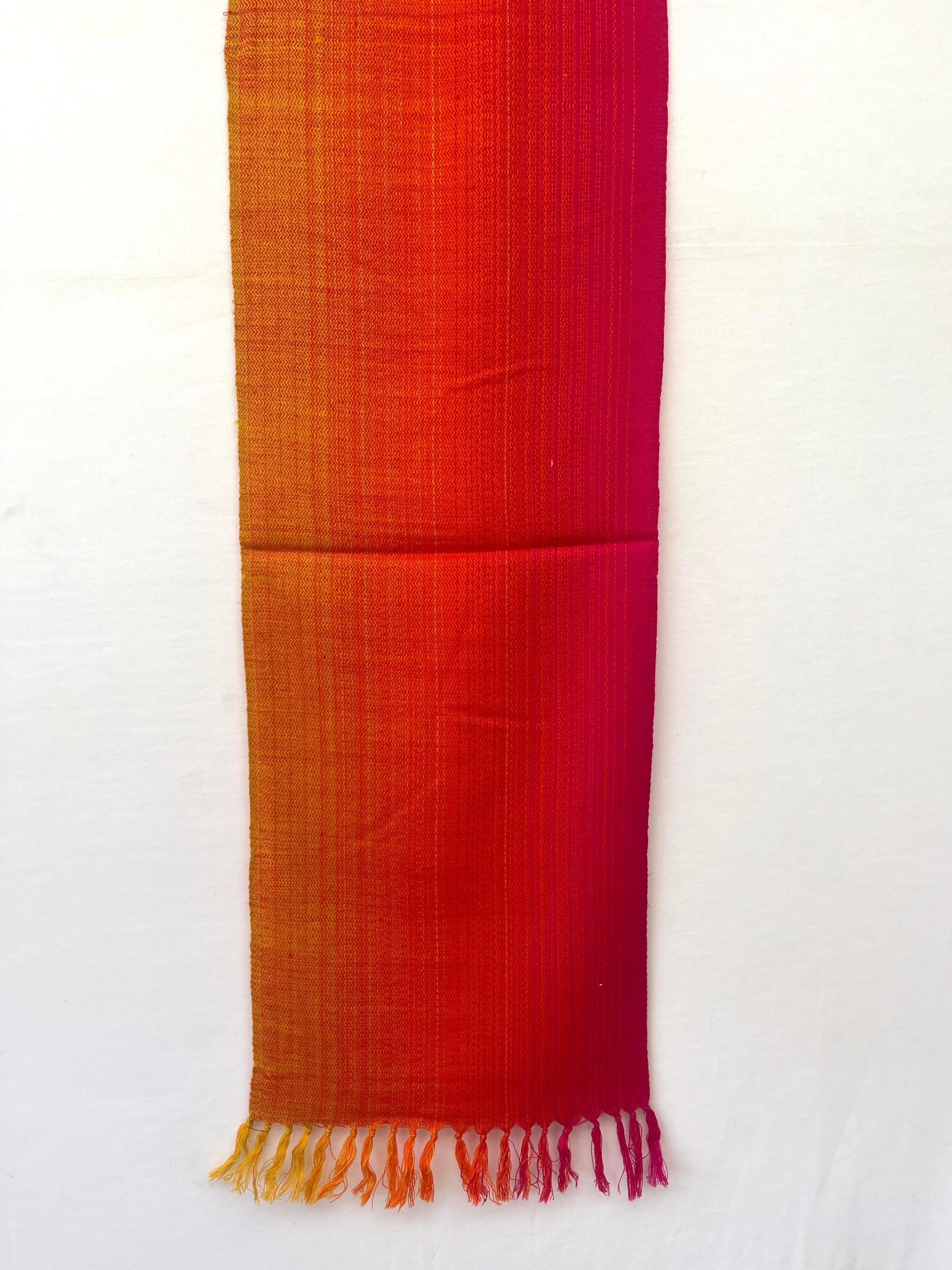 Merino wool scarf woven in vertical ombre shades of yellow, deep orange and red