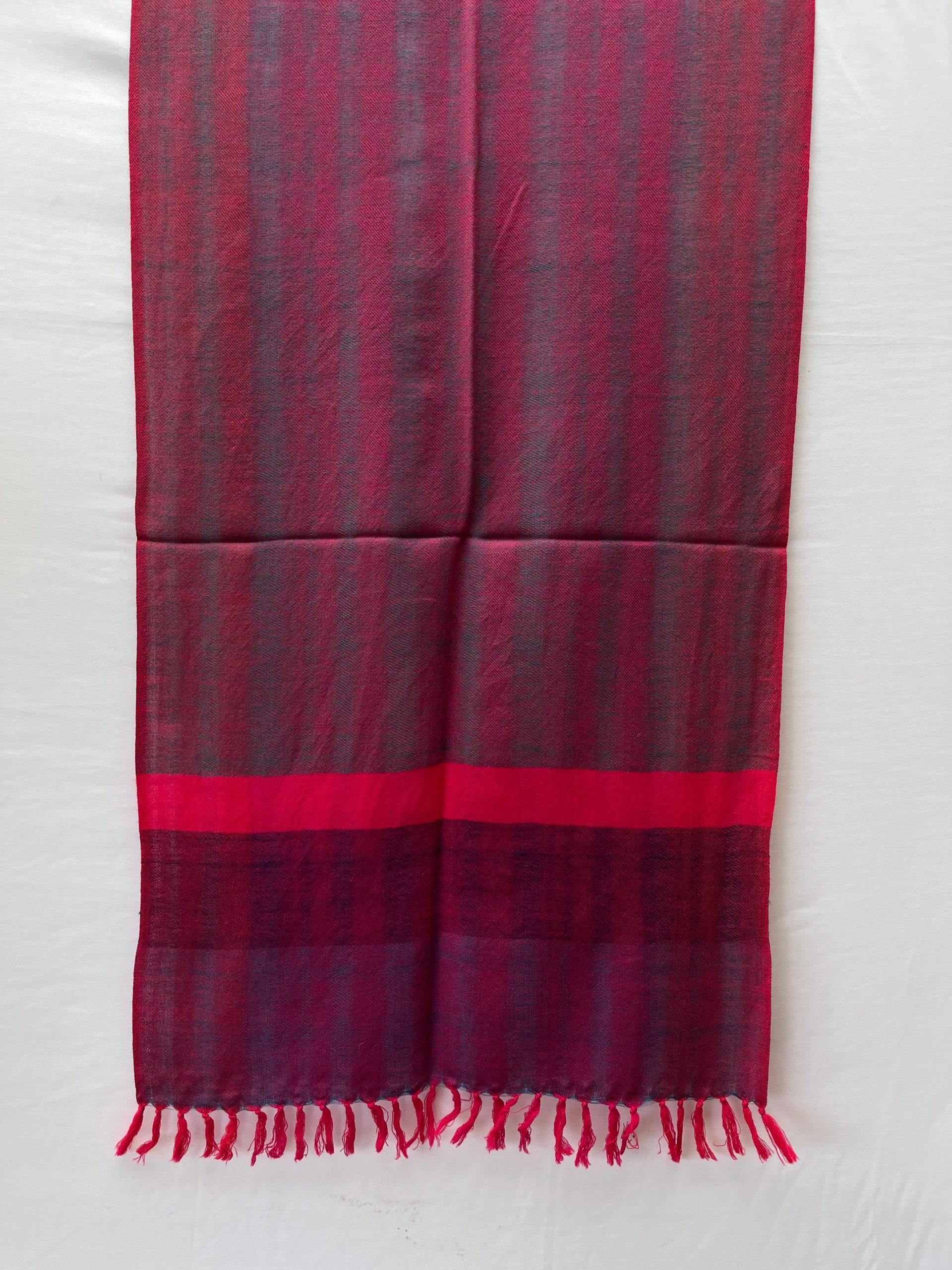 Double shaded merino wool stole in purple and magenta, with a bright neon pink vertical border at the end of the stole