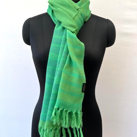 Handwoven merino wool stole in chartreuse green with 1 inch thick navy blue stripes forming a border on one side of the stole