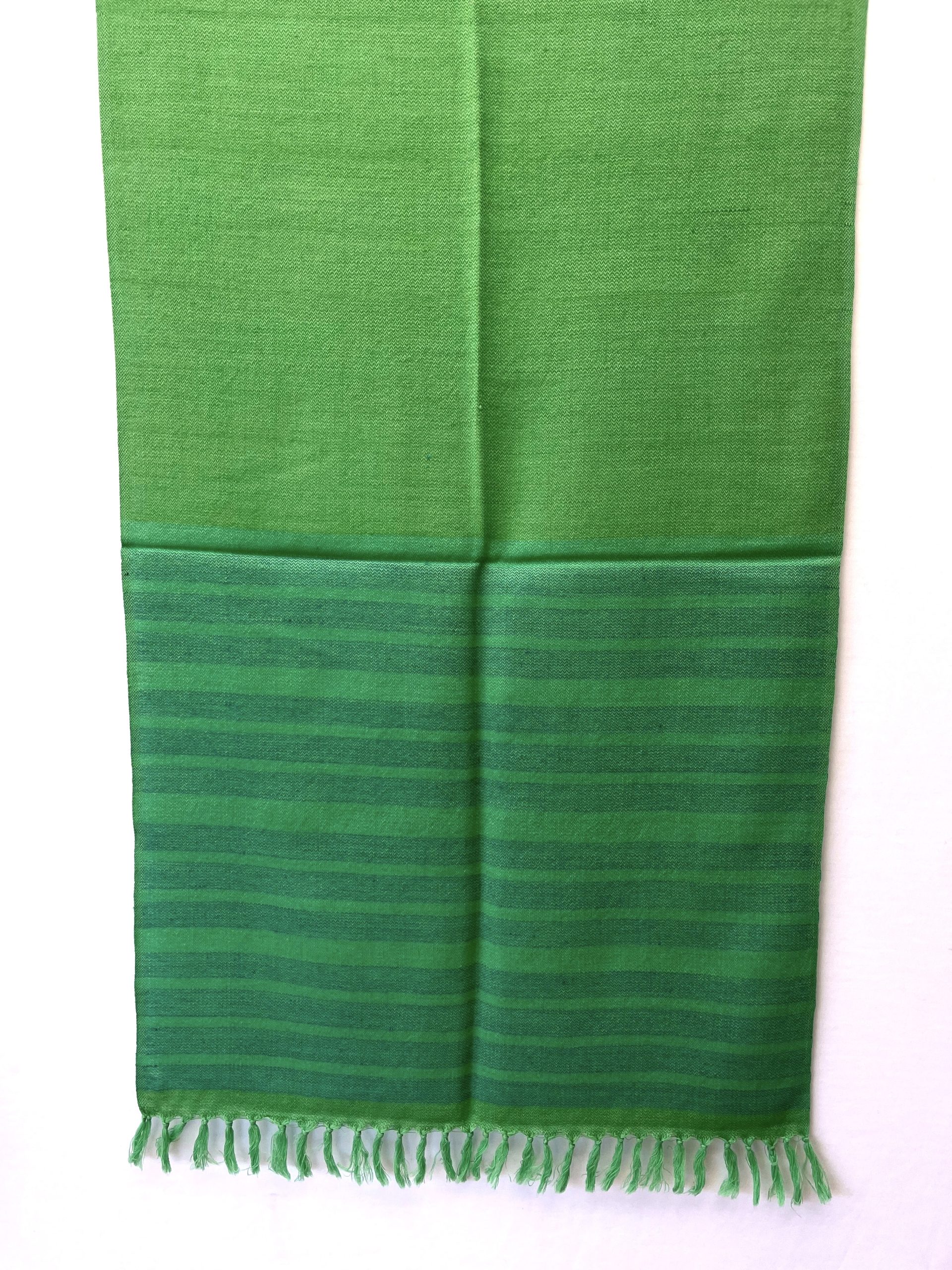 Handwoven merino wool stole in chartreuse green with 1 inch thick navy blue stripes forming a border on one side of the stole