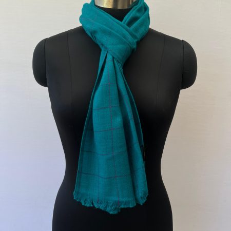 Handwoven merino wool scarf in teal with large navy checks woven into the design