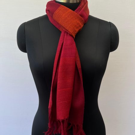 Merino wool handwoven scarf with broad stripes in cherry red, maroon and orange with a dark orange weft
